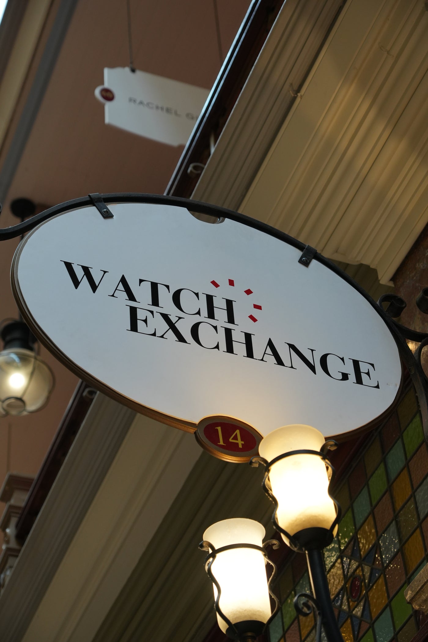 The Watch Exchange oval sign and original arcade lamps at Shop 14, The Strand Arcade, Sydney